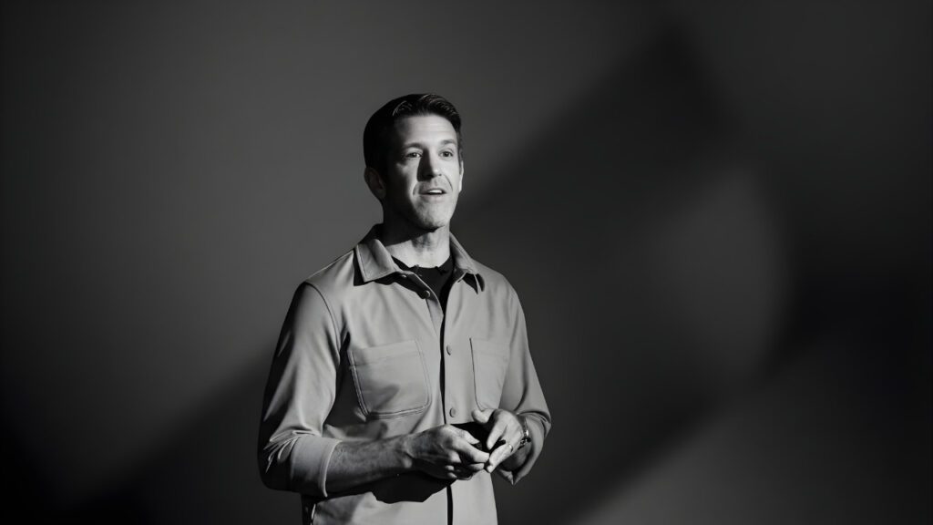 Apple's incoming CEO John Ternus speaking during a black and white hardware presentation event.
