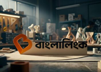 Banglalink logo displayed on a desk in a modern workshop setting representing digital connectivity