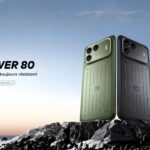 Rugged and durable itel Power 80 smartphone standing on coastal rocks