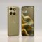 Front and back view of the new Motorola Edge 2026 smartphone in Pantone Martini Olive color highlighting the curved AMOLED display and triple-camera module.
